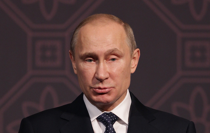 Владимир Путин относит проведение амнистии на счёт «гуманизациии нашей уголовной политики» в связи с 20-летним юбилеем Конституции. Фото: Chung Sung-Jun/Getty Images