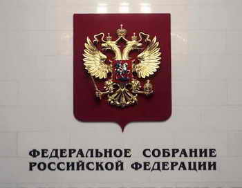  Депутаты Госдумы предлагают в 2014 году изменить принцип расчёта налога на недвижимость. Фото: NATALIA KOLESNIKOVA/AFP/Getty Images