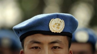 Солдат Народно-освободительной армии Китая, участвующий в миротворческой миссии ООН. 15 сентября 2007 года. Фото: PETER PARKS/AFP/Getty Images