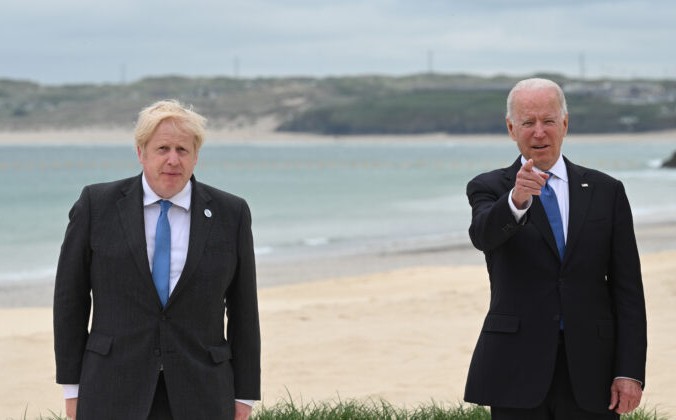CARBIS BAY, CORNWALL - JUNE 11: Prime Minister of United Kingdom, Boris Johnson, and  US President Joe Biden pose during the Leaders official welcome and family photo during the G7 Summit In Carbis Bay, on June 11, 2021 in Carbis Bay, Cornwall. UK Prime Minister, Boris Johnson, hosts leaders from the USA, Japan, Germany, France, Italy and Canada at the G7 Summit. This year the UK has invited India, South Africa, and South Korea to attend the Leaders' Summit as guest countries as well as the EU. (Photo by Leon Neal - WPA Pool/Getty Images)