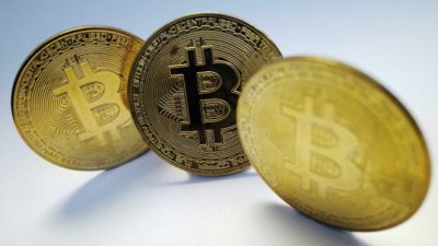 Криптовалюта биткойн, 19 октября 2021 г. (Edgar Su/REUTERS)