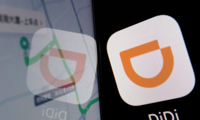 Логотип приложения китайской компании Didi отражается на навигационной карте, отображаемой на мобильном телефоне, на этом иллюстративном снимке, сделанном 1 июля 2021 года. (Florence Lo/Illustration/Reuters)
