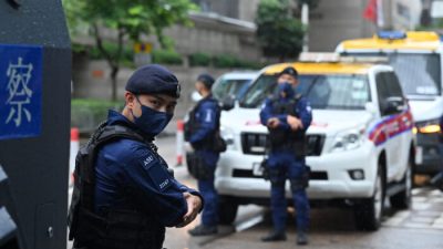 A special unit of the Hong Kong police provides security in the city's Wanchai district on June 30, 2022, as Chinese President Xi Jinping arrives in Hong Kong to attend celebrations marking the 25th anniversary of the city's handover from Britain to China. (Photo by Peter PARKS / AFP) (Photo by PETER PARKS/AFP via Getty Images)