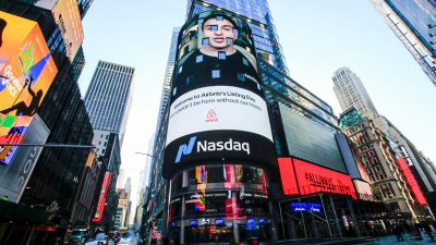 The Airbnb logo is displayed on the Nasdaq digital billboard in Times Square in New York on December 10, 2020. - Home-sharing giant Airbnb was set for its Wall Street debut Thursday with a whopping $47 billion valuation amid a feverish rush for new shares in companies adapting to lifestyle changes imposed by the coronavirus pandemic. (Photo by Kena Betancur / AFP) (Photo by KENA BETANCUR/AFP via Getty Images)